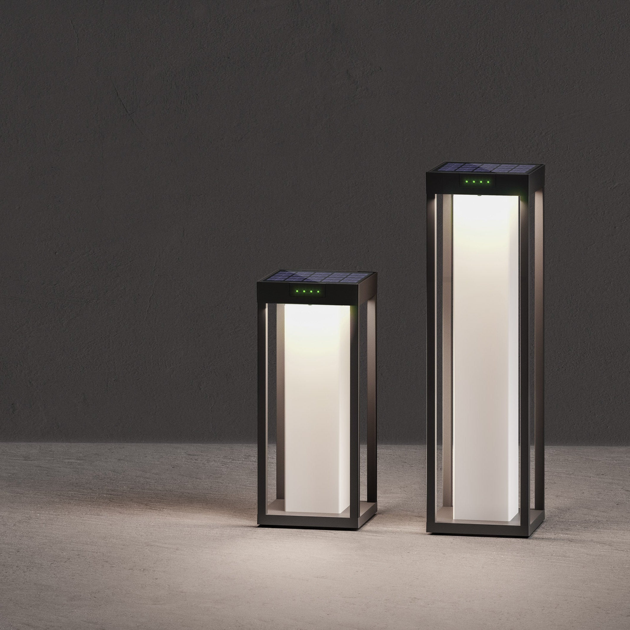 Two rectangular outdoor lights on a gray surface with a dark background